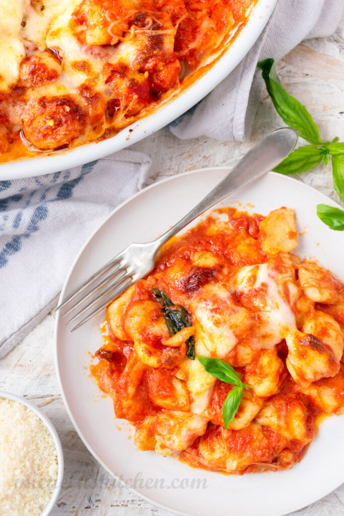 Traditional Gnocchi alla Sorrentina with fresh basil leaves