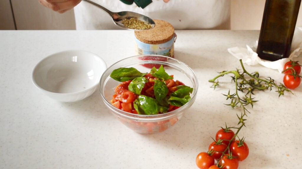 Mix tomato with salt, basil, oregan and oil.